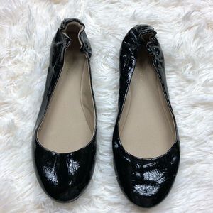 Black faux patent leather round toe flats